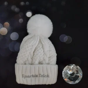 White cable knit beanie with pompom.