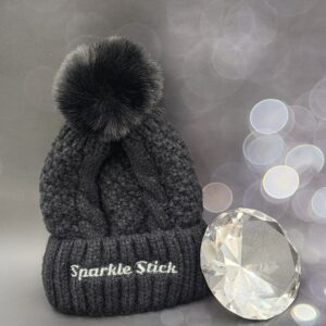 Black knit beanie with pom-pom.